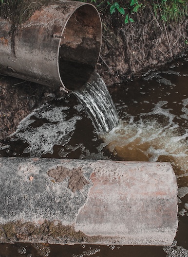 Water leaking from pipes, representing sewage backup coverage.